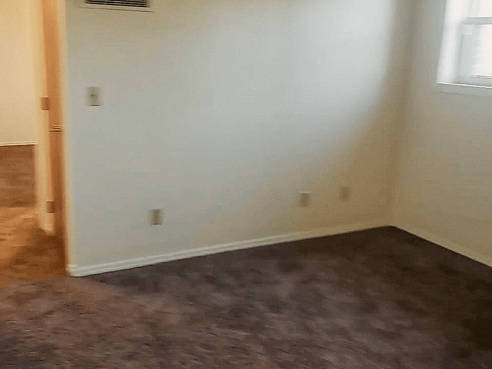 Larger bedroom in Heritage High Unit 002